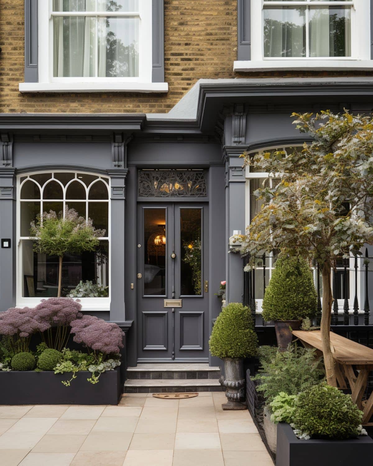 a beautiful victorian property in london with trees, bushes and plants. 