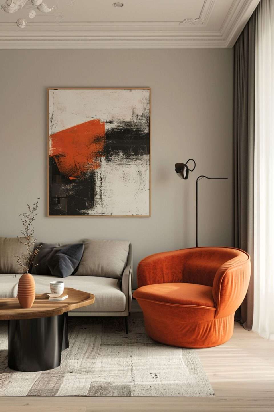 a living room with orange occassional chair and artwork