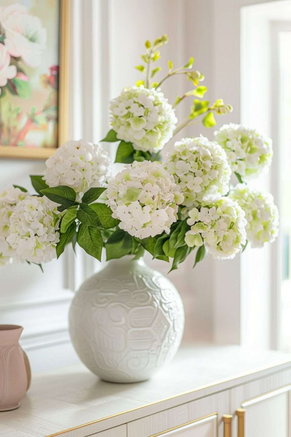 faux hydrangeas in a white vase