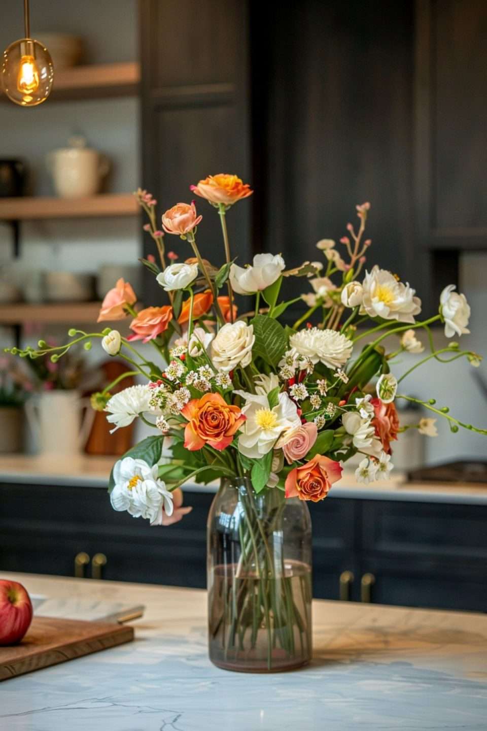 faux flowers on a kitchen island with marble worktops