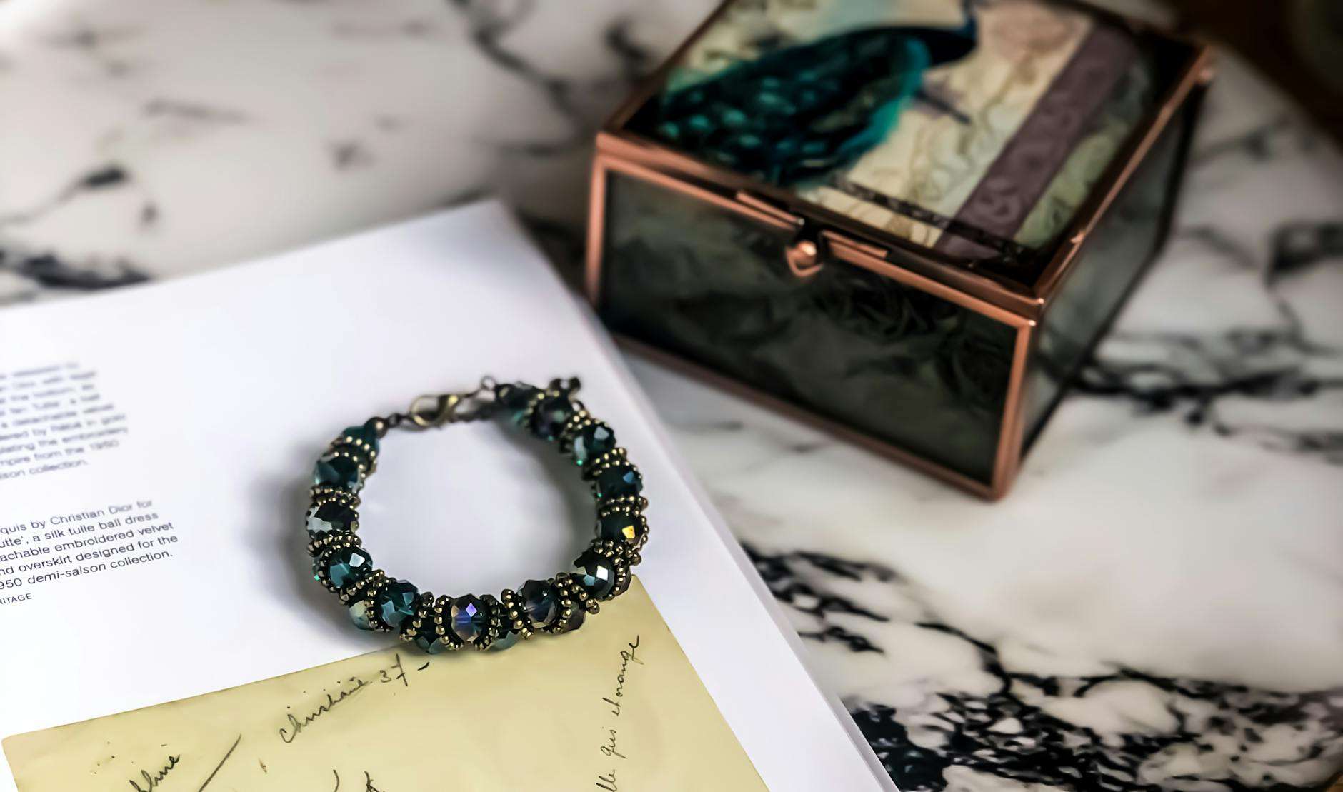 beaded bracelet with a handwritten letter