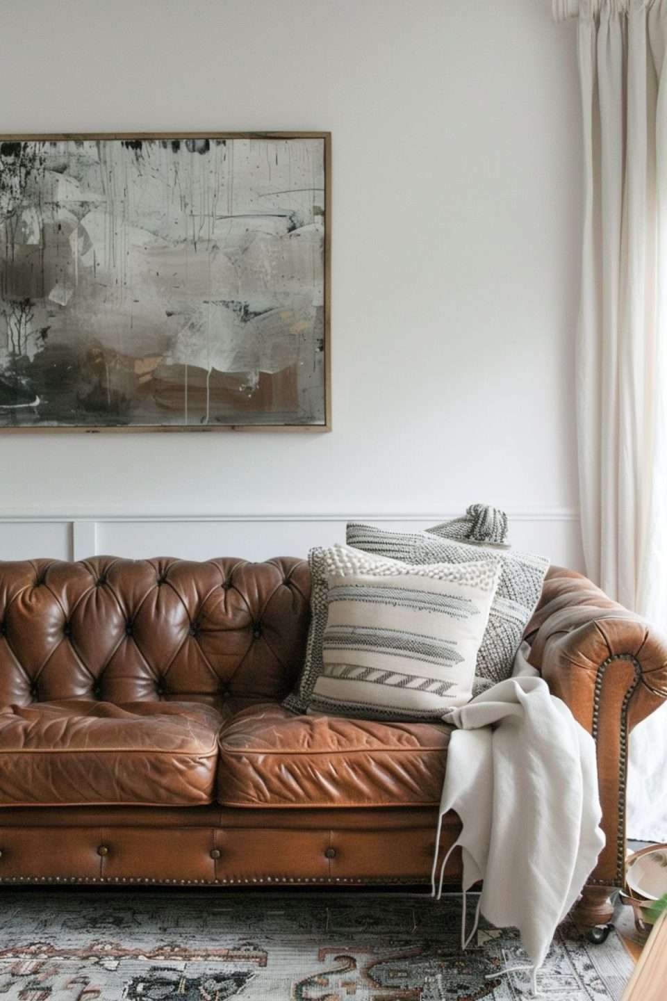 a chesterfield with modern abstract artwork